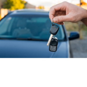 car with car keys held up in front of it