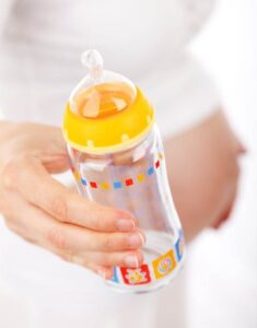 baby bottle in someone's hand