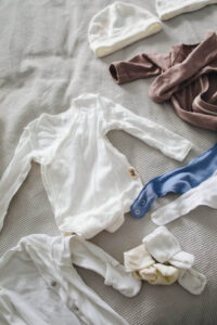 various baby outfits laid out