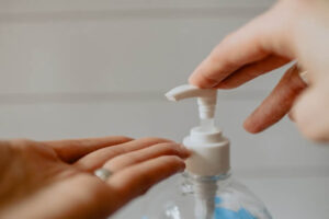 hand sanitizer being squeezed into hand