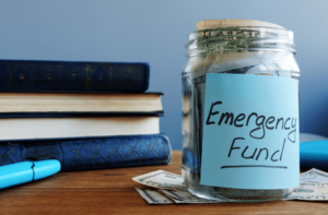 jar full of cash labeled "emergency fund"