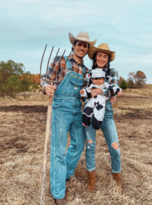 family dressed as farmers and cow for halloween