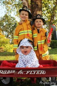 kids dressed as firefighters and dalmation