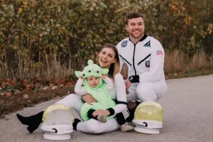 parents dressed as astronaut and baby as alien for halloween