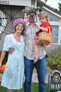 family dressed as little red riding hood, granny, and wolf for halloween