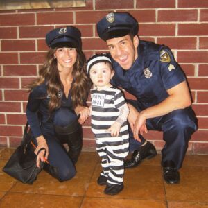 parents dressed as cop and baby as inmate for halloween