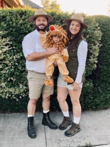 family dressed as safari members and lion for halloween