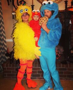 family dressed as Sesame Street characters for halloween