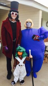 family dressed as Willy Wonka characters for halloween